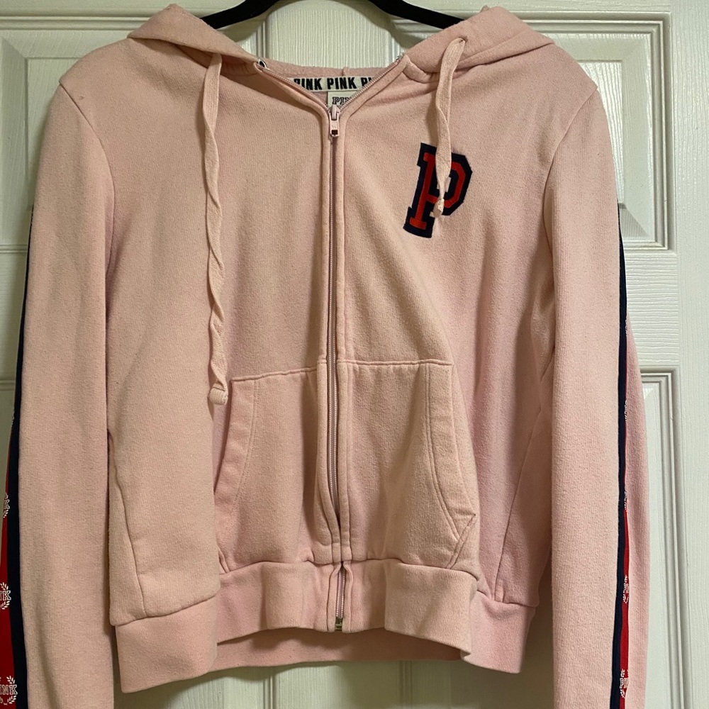 A pink sweater.